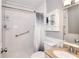Bathroom features a shower/tub combo with decorative curtain, storage cabinet, and single sink vanity at 1379 Branchwood Dr, Snellville, GA 30078