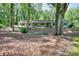 Charming single-story home with a well-maintained lawn, surrounded by mature trees at 1379 Branchwood Dr, Snellville, GA 30078