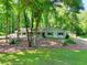 Inviting single-story home with lush lawn and mature trees, providing a serene setting at 1379 Branchwood Dr, Snellville, GA 30078