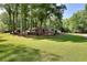 Spacious front yard and mature trees enhance the curb appeal of this single-story home at 1379 Branchwood Dr, Snellville, GA 30078
