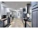 Spacious kitchen featuring stainless steel appliances, granite countertops, and neutral-toned cabinets at 1379 Branchwood Dr, Snellville, GA 30078