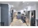 Well-equipped kitchen with stainless steel appliances, granite countertops, and a combination of gray and white cabinets at 1379 Branchwood Dr, Snellville, GA 30078