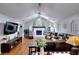 Spacious living room with vaulted ceilings, lots of natural light, fireplace, and wood laminate floors at 1379 Branchwood Dr, Snellville, GA 30078
