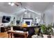 Open living room with vaulted ceilings, a brick fireplace, and a large sectional sofa at 1379 Branchwood Dr, Snellville, GA 30078