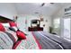Cozy main bedroom includes an exit to a patio, large dresser and TV, and lots of natural light at 1379 Branchwood Dr, Snellville, GA 30078