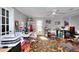 Bright office space with multiple work stations, natural light, and a floral patterned rug at 1379 Branchwood Dr, Snellville, GA 30078