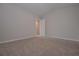 A simple bedroom has neutral colors, carpet, and light colored walls at 16 Deer Place, Villa Rica, GA 30180