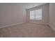 Neutral bedroom featuring cozy carpeting and a bright window for natural light at 16 Deer Place, Villa Rica, GA 30180