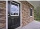 Close up of the front door with stone surround, adding a touch of elegance at 16 Deer Place, Villa Rica, GA 30180