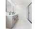 Modern bathroom with double vanity, sleek mirrors, and a spacious glass-enclosed shower at 170 Chandler Trce, Covington, GA 30016