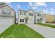 Charming two-story home with neutral siding, complementary shutters, and attached garage at 170 Chandler Trce, Covington, GA 30016