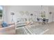 Sun-filled living room featuring modern decor, stylish furnishings, and contemporary lighting at 170 Chandler Trce, Covington, GA 30016