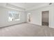 Large main bedroom with lots of natural light, carpeted floors, and access to walk-in closet and bathroom at 170 Chandler Trce, Covington, GA 30016