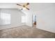 Spacious primary bedroom with plush carpeting, neutral walls, ceiling fan, and an ensuite bathroom at 4527 Baker Grove Nw Rd, Acworth, GA 30101
