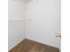 Walk-in closet with built in shelving and plush carpeting at 4527 Baker Grove Nw Rd, Acworth, GA 30101