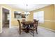 Cozy dining room with chandelier lighting and views into the kitchen at 4527 Baker Grove Nw Rd, Acworth, GA 30101