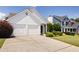 Lovely one-story home with a well-manicured lawn and a long driveway at 4527 Baker Grove Nw Rd, Acworth, GA 30101