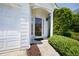 A close up of the front door and manicured shrubbery at 4527 Baker Grove Nw Rd, Acworth, GA 30101