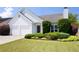 Charming home with a well-manicured lawn and lush landscaping; a two car garage adds convenience at 4527 Baker Grove Nw Rd, Acworth, GA 30101