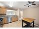 Open kitchen features tile flooring, stainless steel appliances, a kitchen island, and plenty of cabinet space at 4527 Baker Grove Nw Rd, Acworth, GA 30101