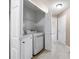 Bright laundry room features modern washer and dryer units, plus ample storage space in a closet at 4527 Baker Grove Nw Rd, Acworth, GA 30101