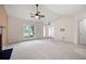 Spacious living room with vaulted ceilings, plush carpeting, and large windows at 4527 Baker Grove Nw Rd, Acworth, GA 30101