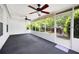 Large sunroom with neutral carpet, large windows and doors that open to backyard and ceiling fans at 4527 Baker Grove Nw Rd, Acworth, GA 30101