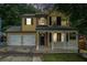 Charming two-story home with a welcoming front porch and a two-car garage, perfect for suburban living at 5292 Windfield Glen Nw Ct, Lilburn, GA 30047