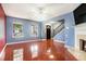 Bright living room features gleaming floors, a fireplace, and plenty of natural light at 5292 Windfield Glen Nw Ct, Lilburn, GA 30047