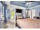 Large main bedroom with soft blue walls, ceiling fan, and a large window at 5292 Windfield Glen Nw Ct, Lilburn, GA 30047