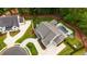 Aerial view of a luxury home with a manicured lawn, pool, and outdoor seating, perfect for entertaining at 126 Owens Mill Pl, Canton, GA 30115