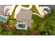 A stately home with a pristine lawn, garden, and luxurious pool and patio area viewed from above at 126 Owens Mill Pl, Canton, GA 30115