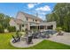 Large backyard with inground pool, firepit, manicured lawn, and mature trees at 126 Owens Mill Pl, Canton, GA 30115