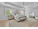 Serene bedroom with tray ceilings, neutral color palette, and decorative mirror at 126 Owens Mill Pl, Canton, GA 30115