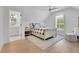 Bright bedroom with ensuite bathroom, cozy decor, and a plush armchair at 126 Owens Mill Pl, Canton, GA 30115