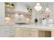 Elegant kitchen featuring stainless appliances, island with seating, pendant lighting, and stylish backsplash at 126 Owens Mill Pl, Canton, GA 30115