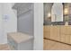 Mudroom with a built-in bench, coat hooks, drawers for storage, and access to a half bathroom at 126 Owens Mill Pl, Canton, GA 30115