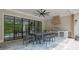 Covered outdoor kitchen featuring stainless steel appliances, built-in grill, and dining area at 126 Owens Mill Pl, Canton, GA 30115