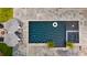 Aerial view of a modern pool with lounge chairs and umbrellas, perfect for relaxation and entertainment at 126 Owens Mill Pl, Canton, GA 30115