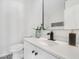 Modern bathroom featuring white vanity, patterned tile flooring, and chic mirror at 3100 Mount Gilead Sw Rd, Atlanta, GA 30311