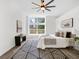Bright bedroom with sleek ceiling fan, large window, and stylish accent rug at 3100 Mount Gilead Sw Rd, Atlanta, GA 30311