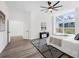 Bright bedroom with large window, modern ceiling fan, and stylish black and white rug at 3100 Mount Gilead Sw Rd, Atlanta, GA 30311