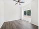 Minimalist bedroom with hardwood floors, a ceiling fan and a bright window at 3100 Mount Gilead Sw Rd, Atlanta, GA 30311