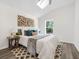 Cozy bedroom features vaulted ceiling, window with natural light and neutral decor at 3100 Mount Gilead Sw Rd, Atlanta, GA 30311