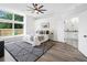 Bedroom featuring large window, neutral decor, and ensuite bathroom at 3100 Mount Gilead Sw Rd, Atlanta, GA 30311