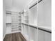 Walk-in closet with custom built-in shelving and wood flooring, ready for organization at 3100 Mount Gilead Sw Rd, Atlanta, GA 30311