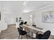 Modern dining area showcasing a stylish table, contemporary lighting, and an open floor plan at 3100 Mount Gilead Sw Rd, Atlanta, GA 30311