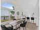 Bright dining room features modern lighting, table, and adjacent island with bar stools at 3100 Mount Gilead Sw Rd, Atlanta, GA 30311