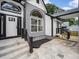 Covered walkway with modern black railing that leads to the main house and includes side wood deck at 3100 Mount Gilead Sw Rd, Atlanta, GA 30311