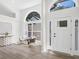 Bright foyer features luxury vinyl plank flooring, arched windows, and a modern decor at 3100 Mount Gilead Sw Rd, Atlanta, GA 30311